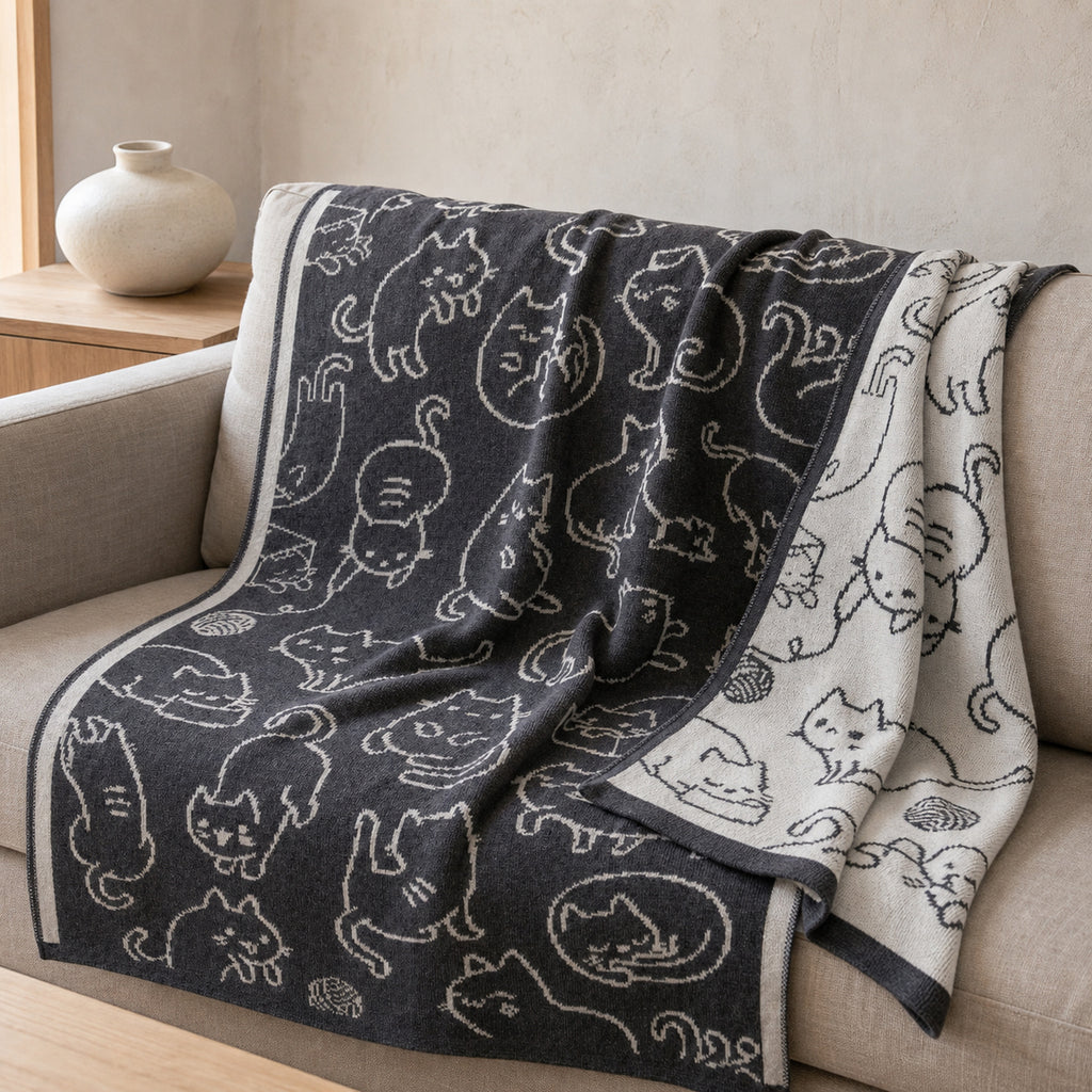 Whiskers knitted blanket – Grey / Cream, lifestyle view