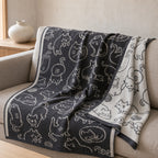 Whiskers knitted blanket – Grey / Cream, lifestyle view