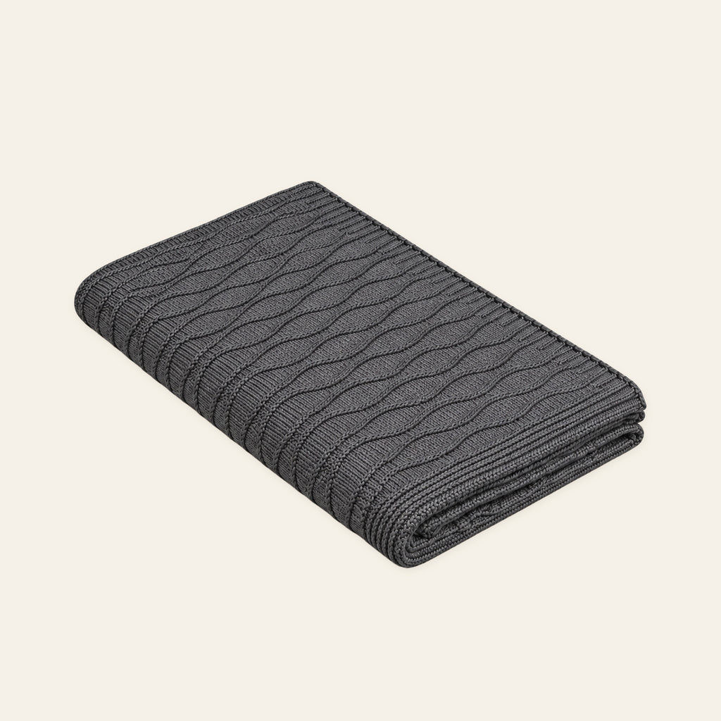 Soča knitted blanket in Grey, studio view
