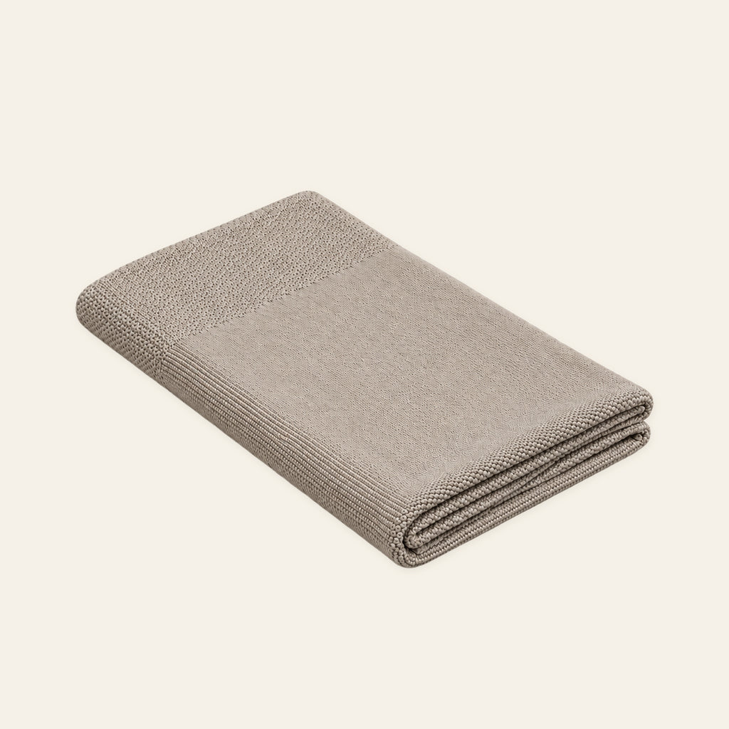 Tinka knitted blanket in Light beige, folded studio view