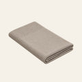 Tinka knitted blanket in Light beige, folded studio view