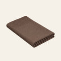 Tinka knitted blanket in Taupe, studio view
