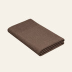 Tinka knitted blanket in Taupe, studio view