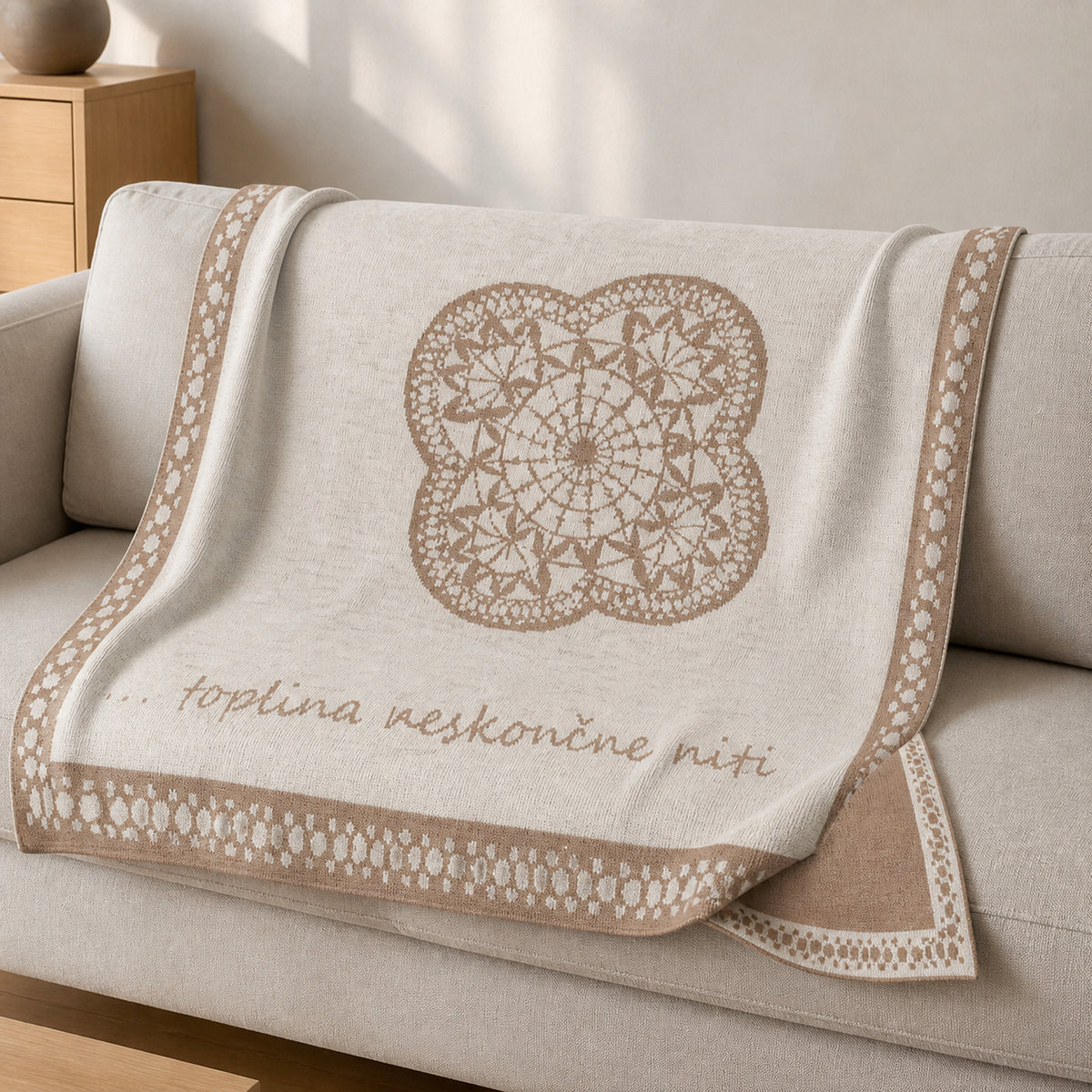 Endless Thread knitted blanket in Sand / Cream, lifestyle view