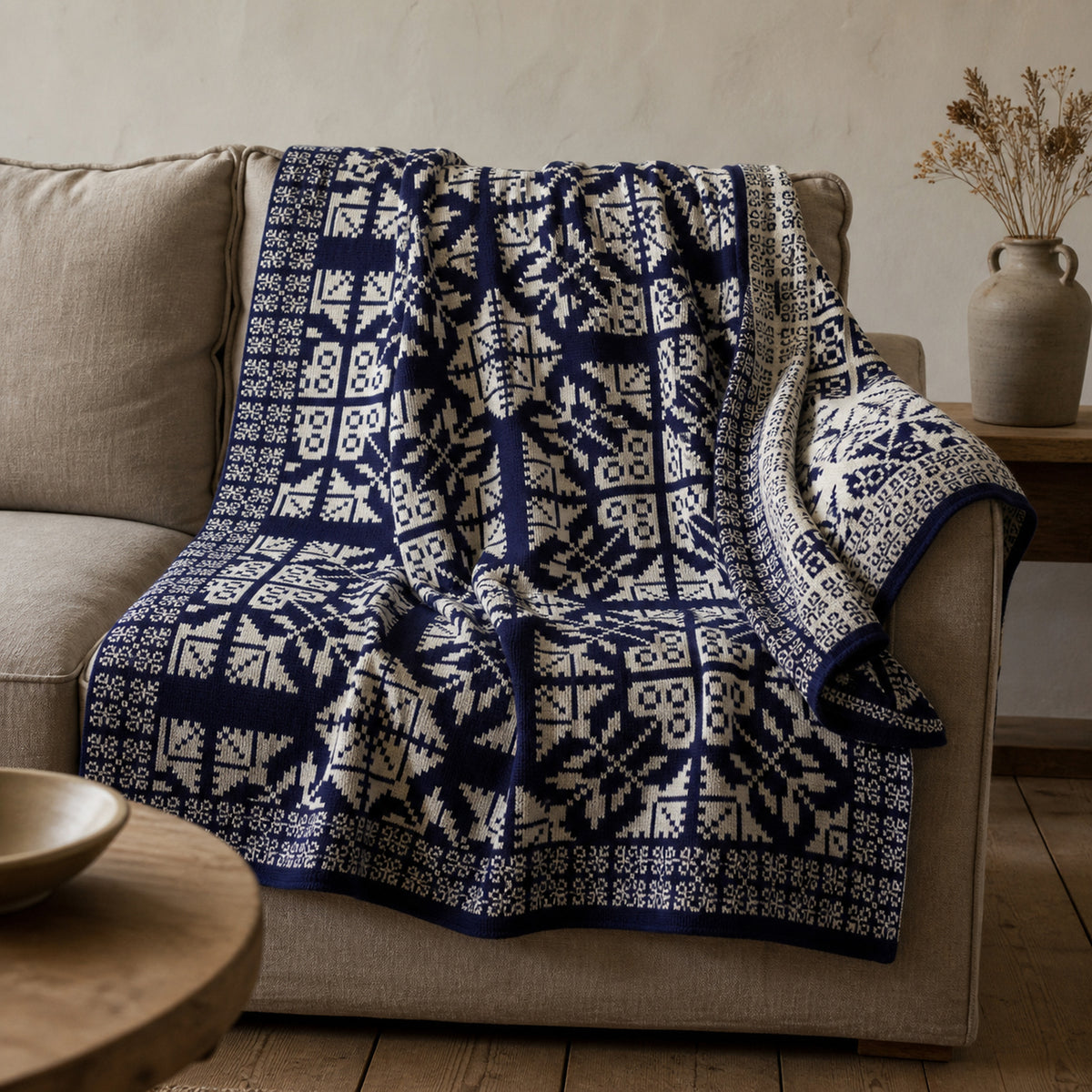 Velika Planina knitted blanket in Blue / Cream, lifestyle view