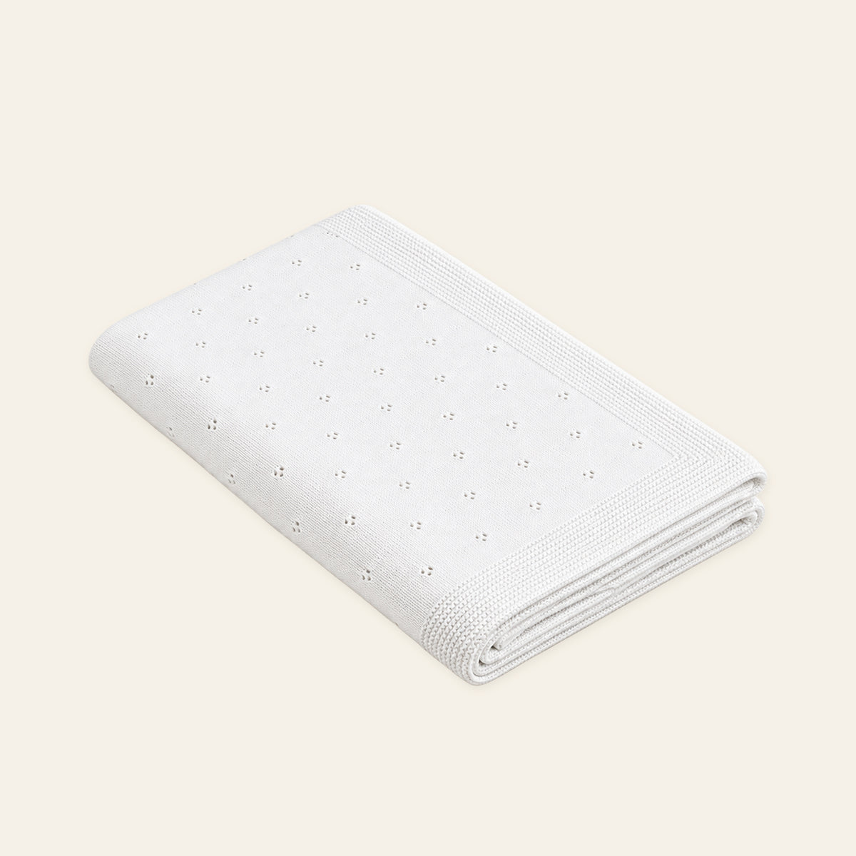 Zora knitted blanket in White, folded studio view