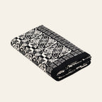 Mala Planina knitted blanket in Black / Cream, studio view