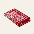 Alpine Heritage knitted blanket in Dark red / White, studio view