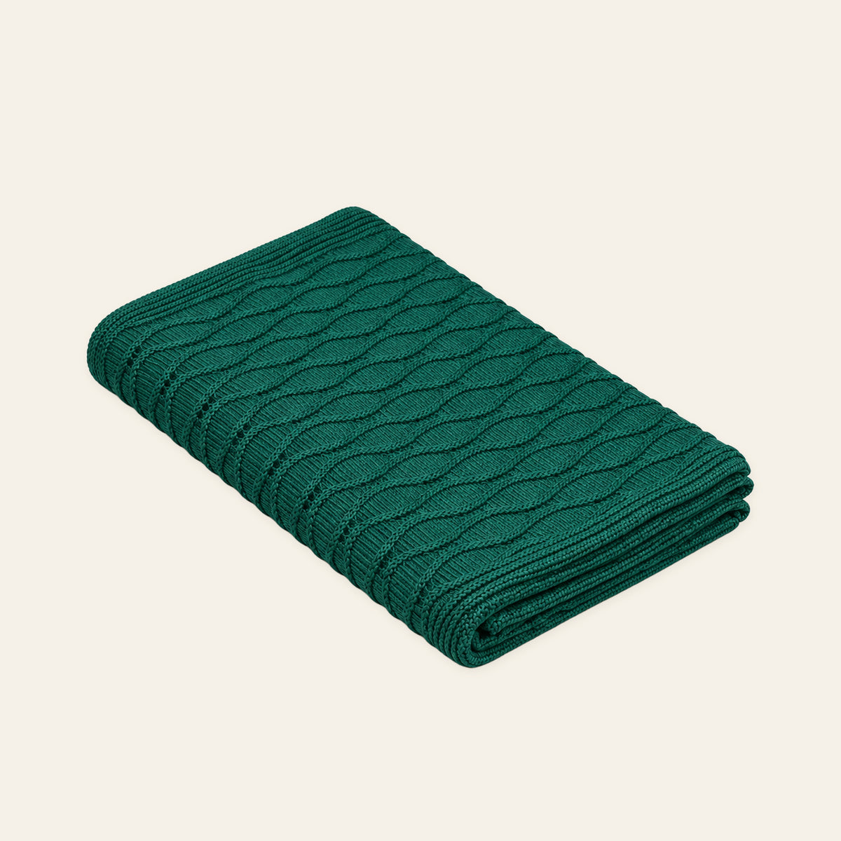 Soča knitted blanket in Emerald, studio view