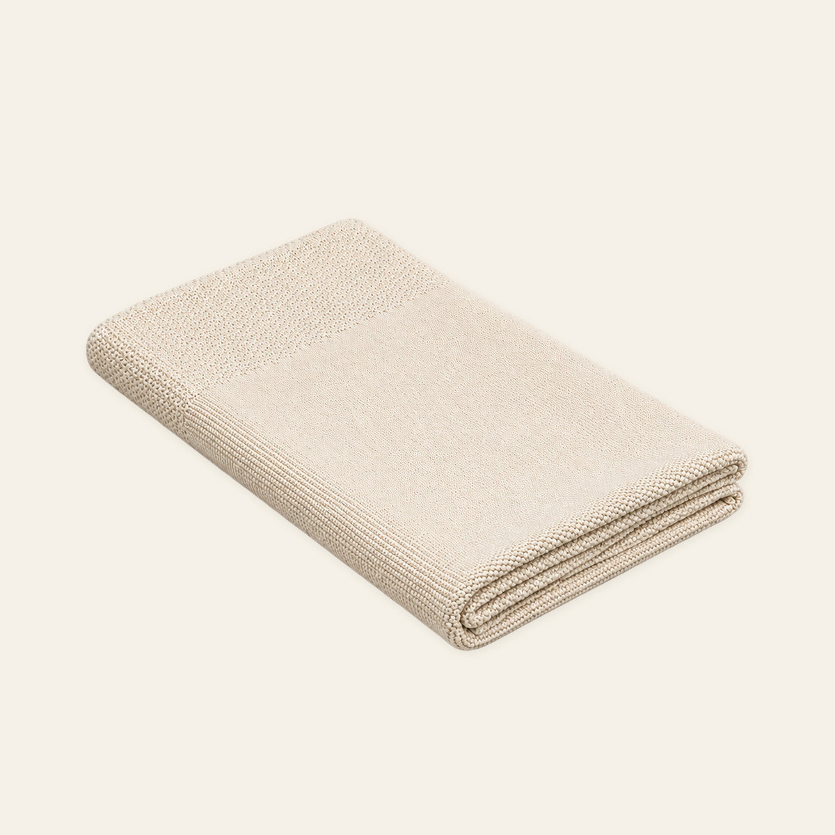 Tinka knitted blanket in Cream, studio view