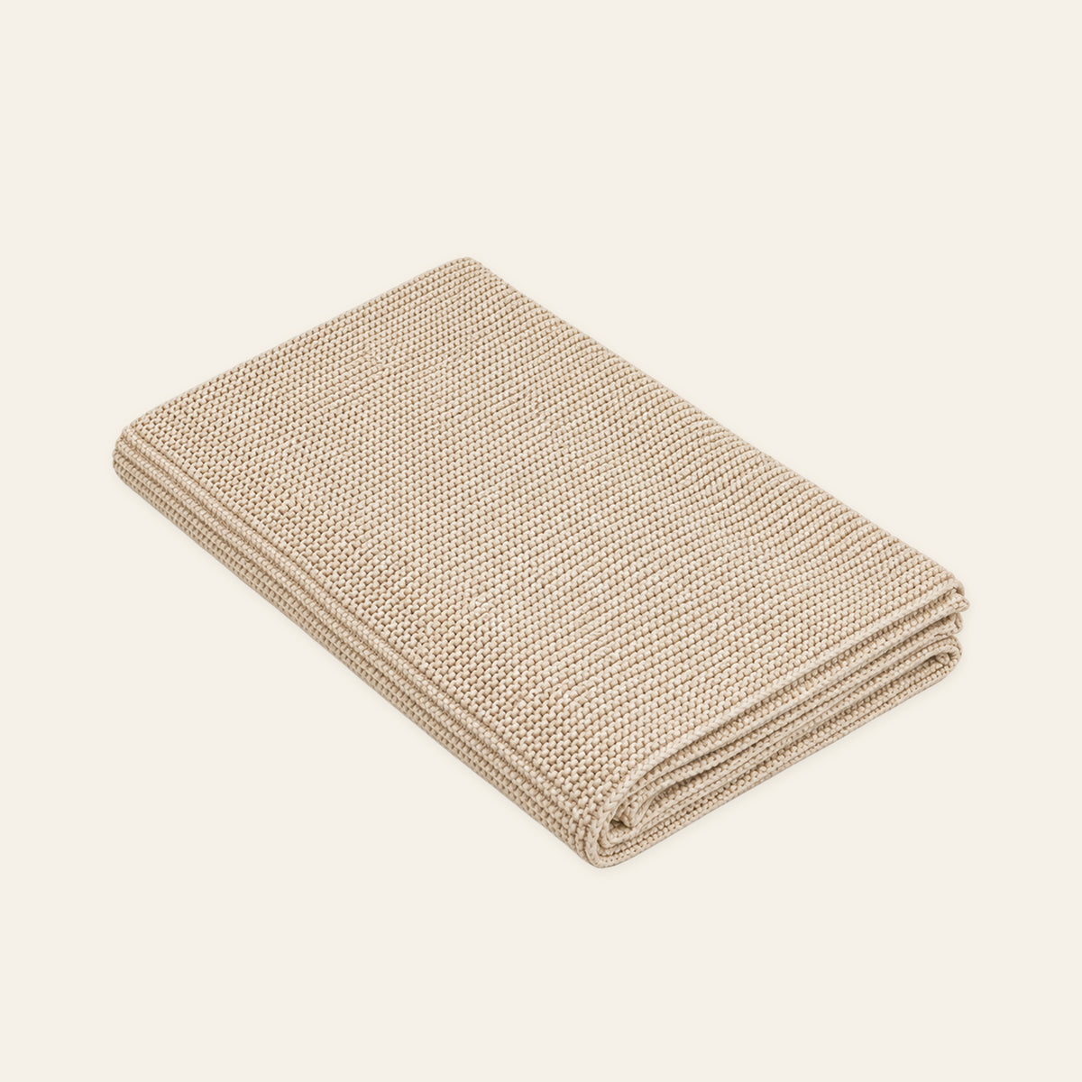 Pislak Zarja Cotton Children's Blanket in cream, folded to show its fine knitted texture.
