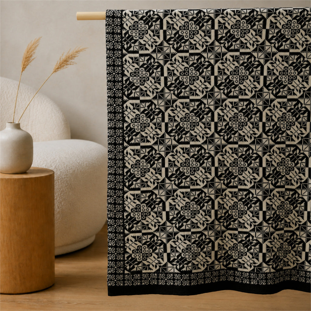 Mala Planina knitted blanket in Black / Cream, pattern and texture detail