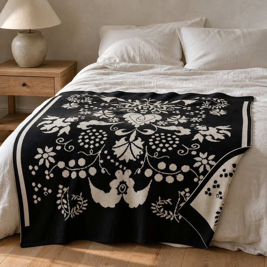 Carnation knitted blanket in Black / Cream, alternate lifestyle view