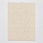 Zarja cotton blanket in cream, shown fully unfolded with fine garter-knit rows and a simple narrow edge.