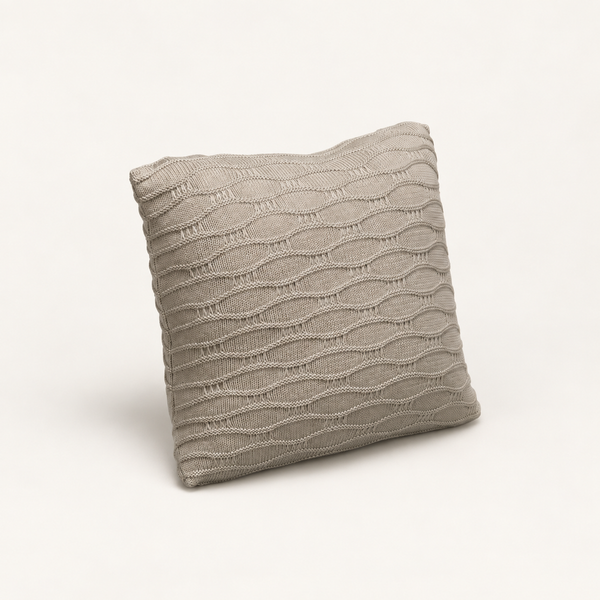 Soča knitted cushion cover in beige, front studio view