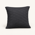 Soča knitted cushion cover in anthracite, front studio view