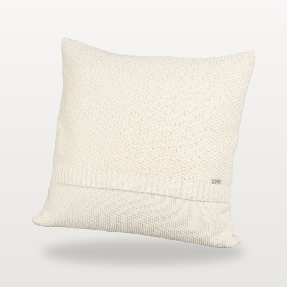 Tinka textured knitted cushion cover in cream, front studio view